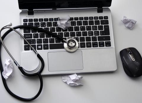 laptop keyboard with stethoscope depicting an application health check