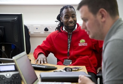 Trades Union Congress – image of two people talking to each other at work