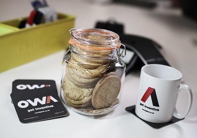 A table with tea and biscuits at an OWA project meeting