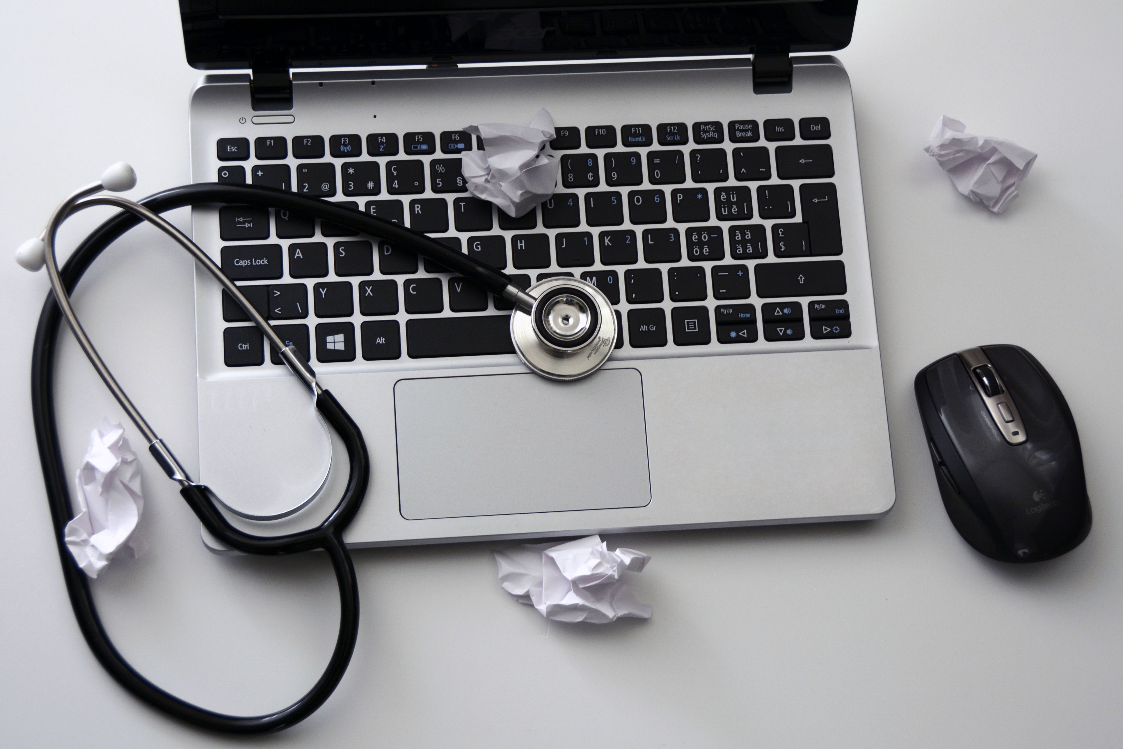 laptop keyboard with stethoscope depicting an application health check