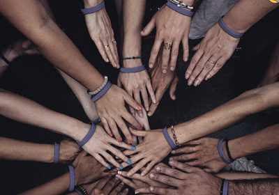 Hands joined together showing CHS Alliance making aid work better