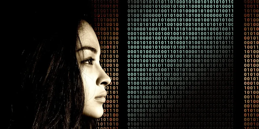 A woman examines binary code, symbolizing her role in Legacy System Support and technology analysis