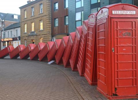 Red telephone boxes like dominos