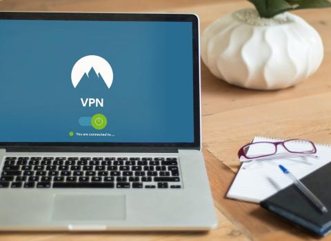 Laptop with VPN on desk.
