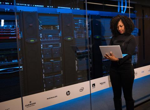 woman checking servers to ensure ransomware protection in place