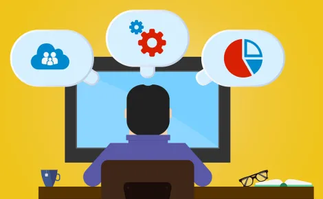 A person at a desk with a computer screen, featuring icons above, representing Legacy System Support