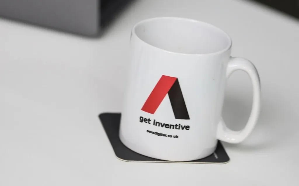 OWA cup and pens ready on table to start work