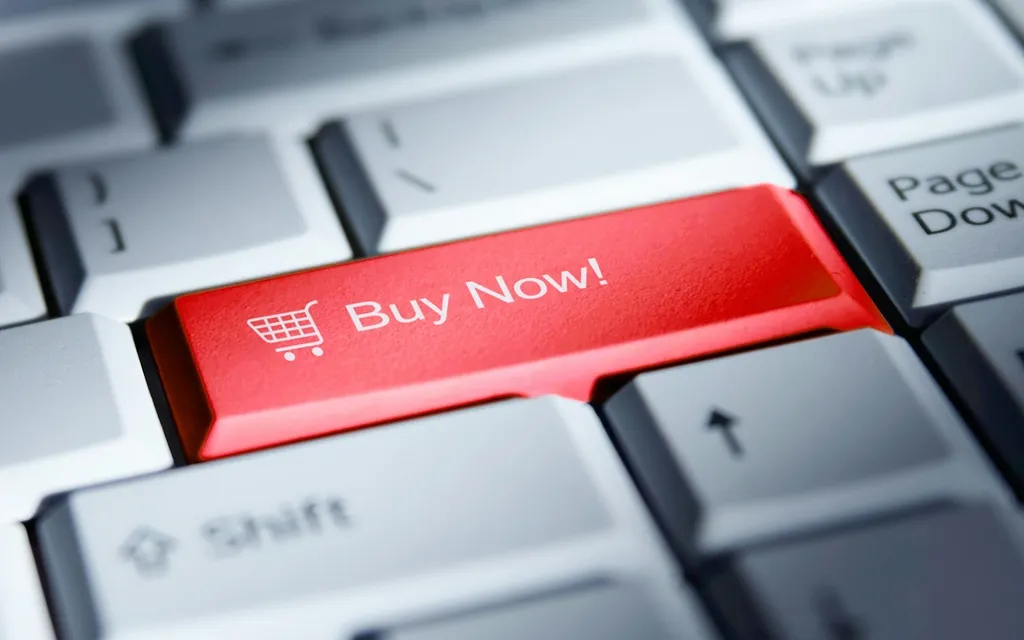 Buy now button highlighted on a computer keyboard, indicating an option to make a purchase online.