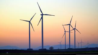 Wind turbines against the sky showing renewable energy generation for greater sustainability