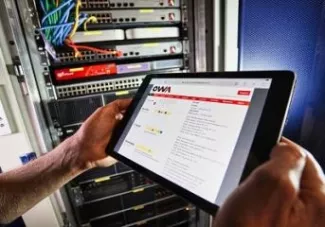 An OWA development project running on a tablet in front of a rack of servers